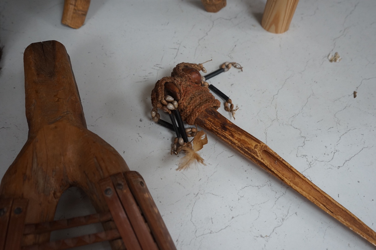 A Papua New Guinea ceremonial bone dagger, a painted straw mask, a tribal instrument and a carved stool. Condition - fair/good